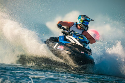 Man surfing on boat