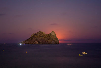 Scenic view of sea against sky at night