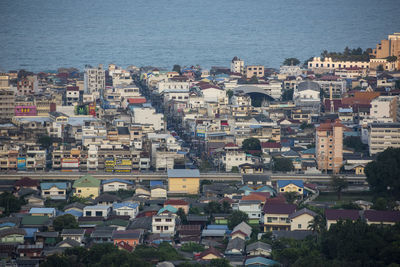 High angle view of townscape by sea