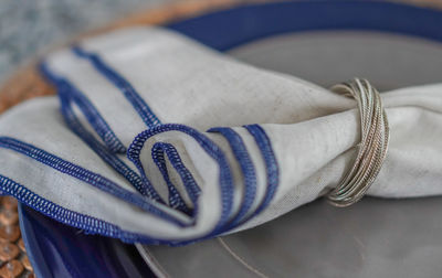 Close-up of shoes on blue table