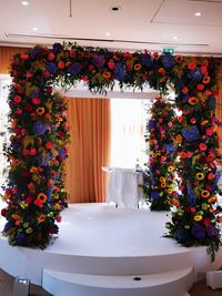 Flowers in vase against wall