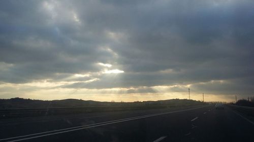 View of railroad tracks against cloudy sky