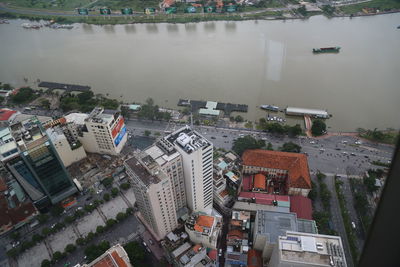High angle view of buildings by river in city