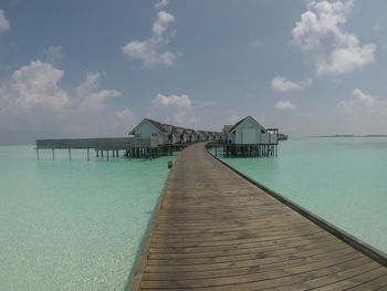 Pier over sea against sky