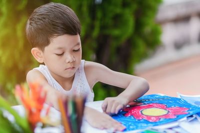 Close-up of cute girl playing with toys