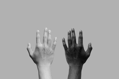 Close-up of hand against white background