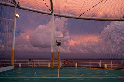 View of basketball hoop against sky during sunset