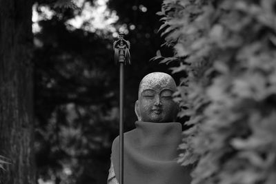 Close-up of buddha statue outdoors 