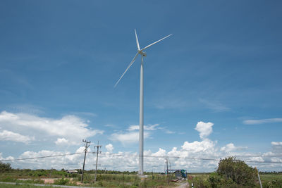 Low angle view of windmill against sky