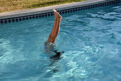 Low section of person in swimming pool