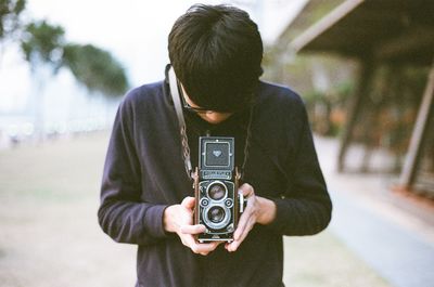 Woman photographing through smart phone