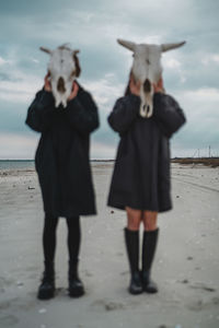 People standing on beach