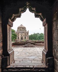 View of old temple building against sky