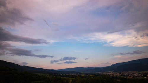 Scenic view of mountains against sky during sunset