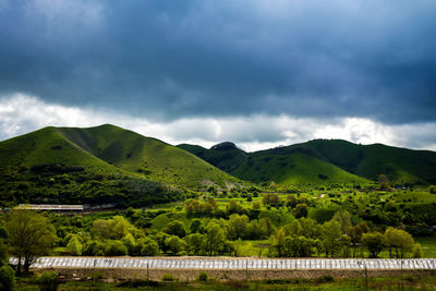 Scenic view of mountains against cloudy sky