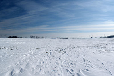 Scenic view of snow field against sky