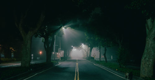 View of illuminated street at night