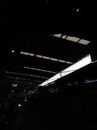 Low angle view of illuminated ceiling at night