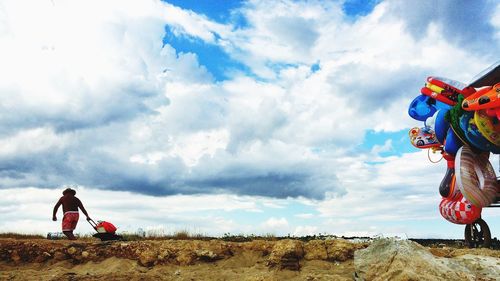 Scenic view of landscape against cloudy sky