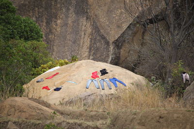 Scenic view of rocks on land against mountain