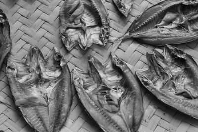 High angle view of dried fish on wicker plate