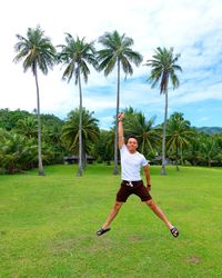 Full length of man and palm tree