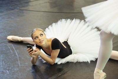 Portrait of young woman using mobile phone