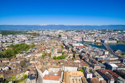 High angle view of townscape against blue sky