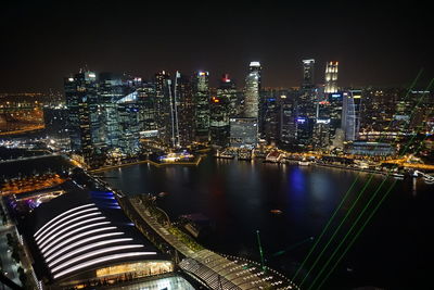 Aerial view of city lit up at night