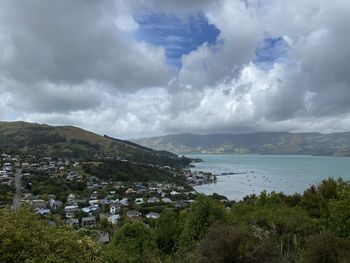 Panoramic view of townscape by sea against sky