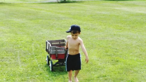 Boy standing on grass