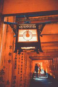 Illuminated lanterns hanging outside building