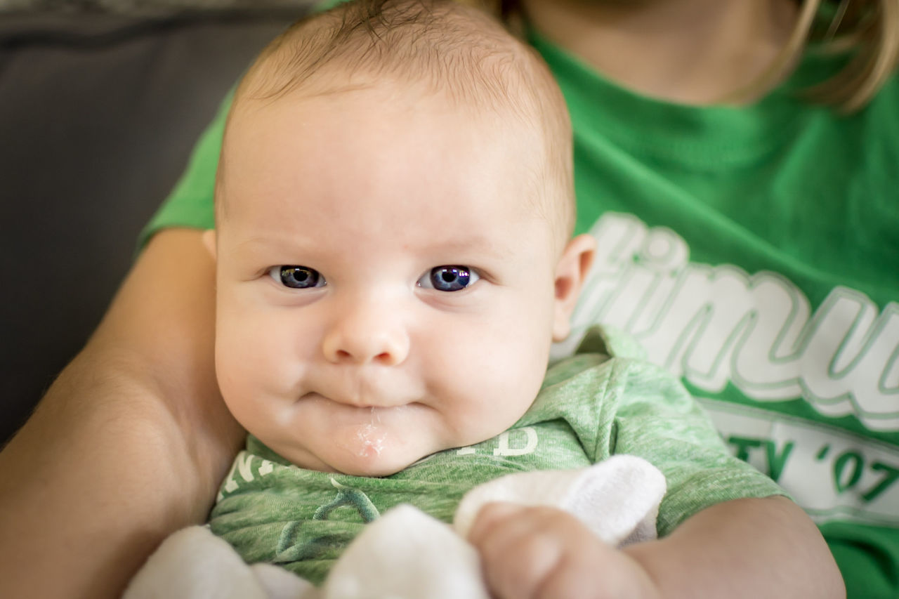 baby, innocence, real people, cute, headshot, portrait, babyhood, front view, looking at camera, close-up, indoors, lifestyles, babies only, one person, beginnings, people, day, adult