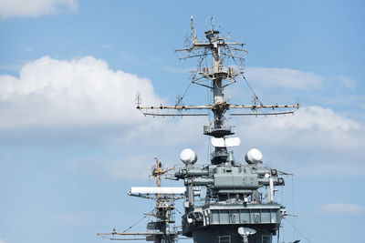 Low angle view of communications tower against sky