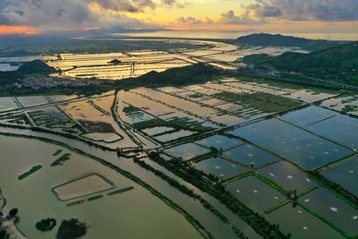 Aerial view of agricultural field against sky