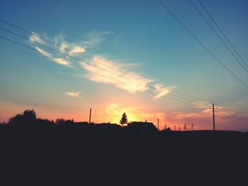 Rural scene against blue sky at sunset