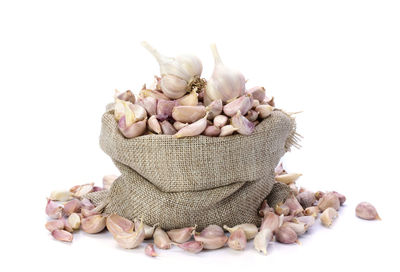 Close-up of roasted coffee beans against white background