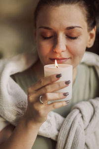 Close-up of woman using mobile phone