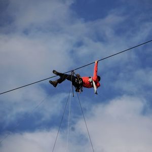 Low angle view of airshow against sky