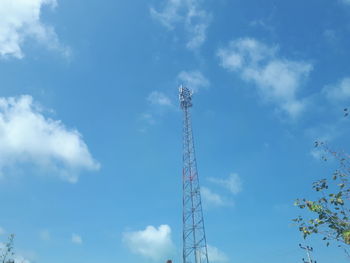 Low angle view of communications tower against sky