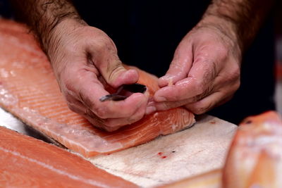 Close-up of man preparing food