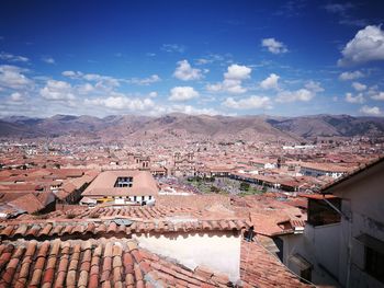 High angle view of mountains against blue sky