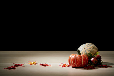 Close-up of pumpkins against black background