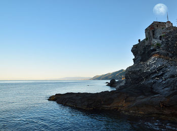 Scenic view of sea against clear blue sky