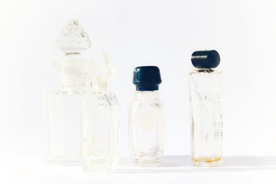 Close-up of wineglass on table against white background