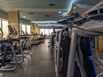 Close-up of treadmills in gym