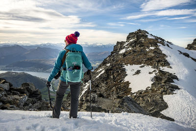 Alpine hiking in snow covered mountains, the remarkables, new zealand