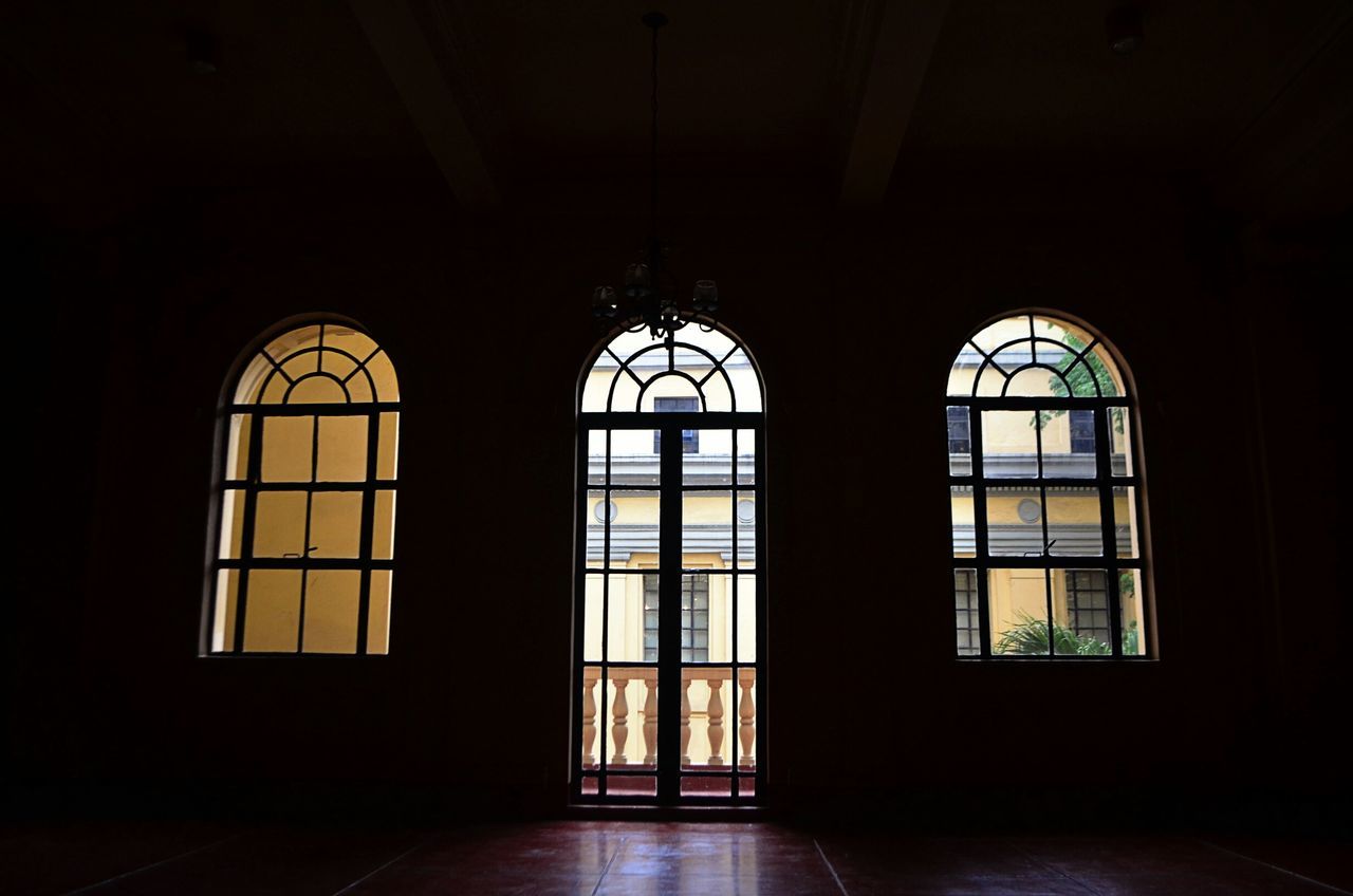 indoors, window, architecture, built structure, glass - material, transparent, home interior, ceiling, arch, no people, pattern, interior, geometric shape, stained glass, design, dark, house, closed, architectural feature, day