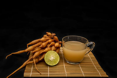 Drink on table against black background