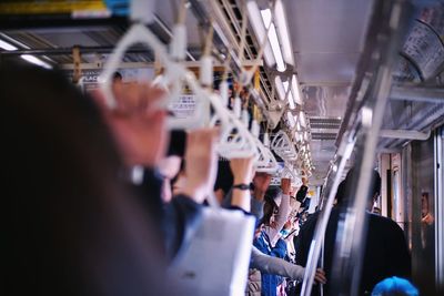 People standing inside the train in japan